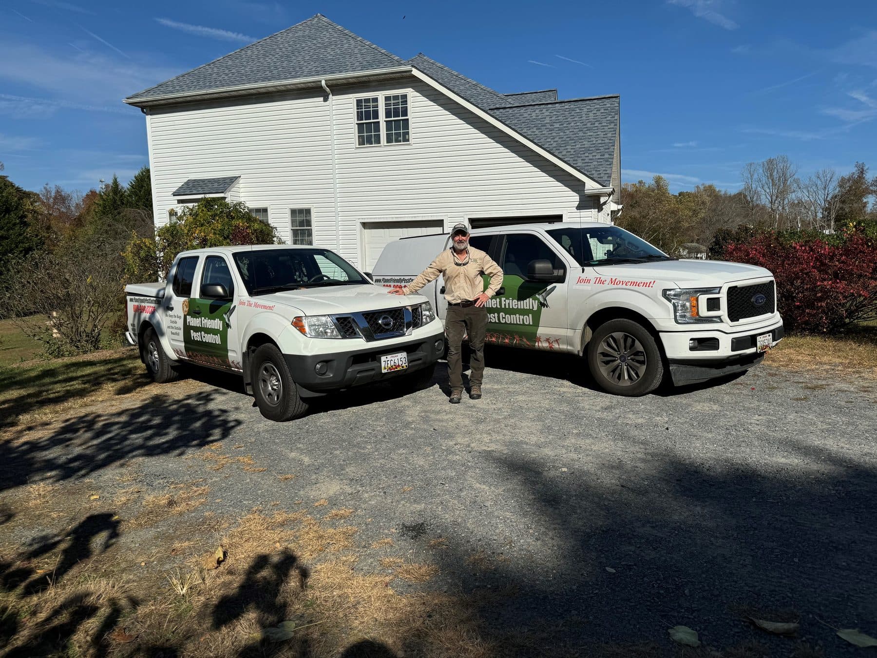 Planet Friendly Pest Control's branded service trucks and owner at a Northern Virginia home — the local team behind every visit