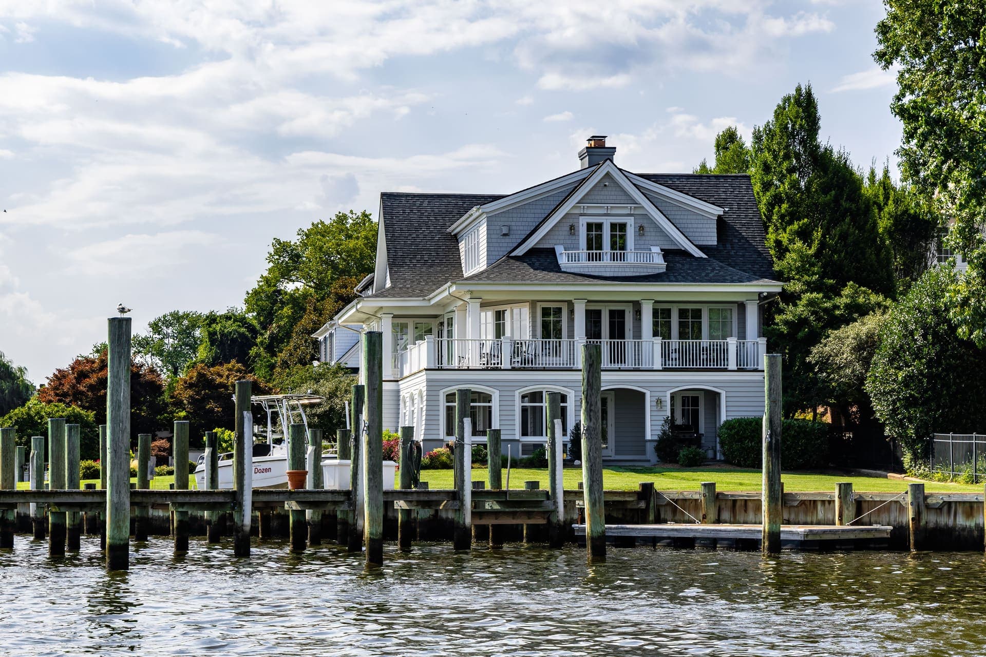 A handsome Chesapeake waterfront home with a private dock in Southern Maryland — the home environment where pest activity begins outdoors