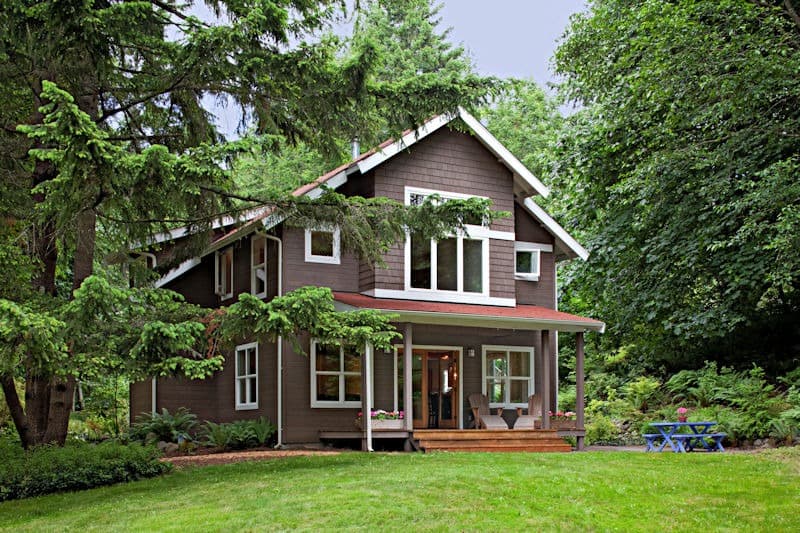 A single-family home set among wooded lots — the conditions that drive local pest pressure