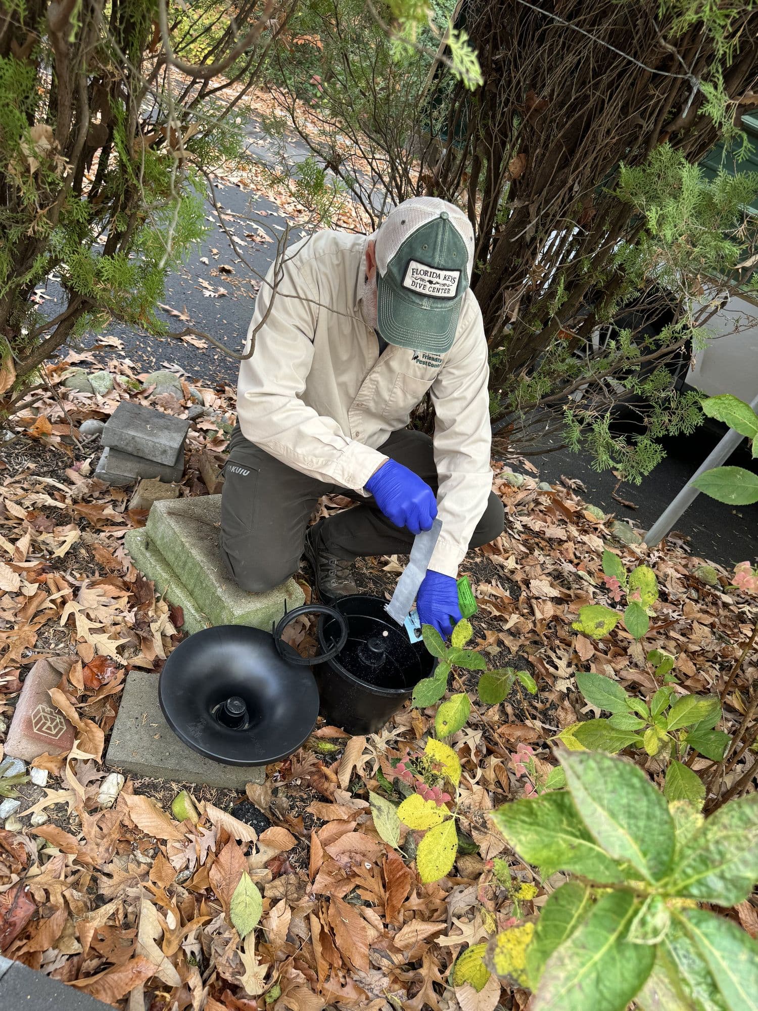 A Planet Friendly Pest Control technician performing an exterior treatment near Dunkirk MD