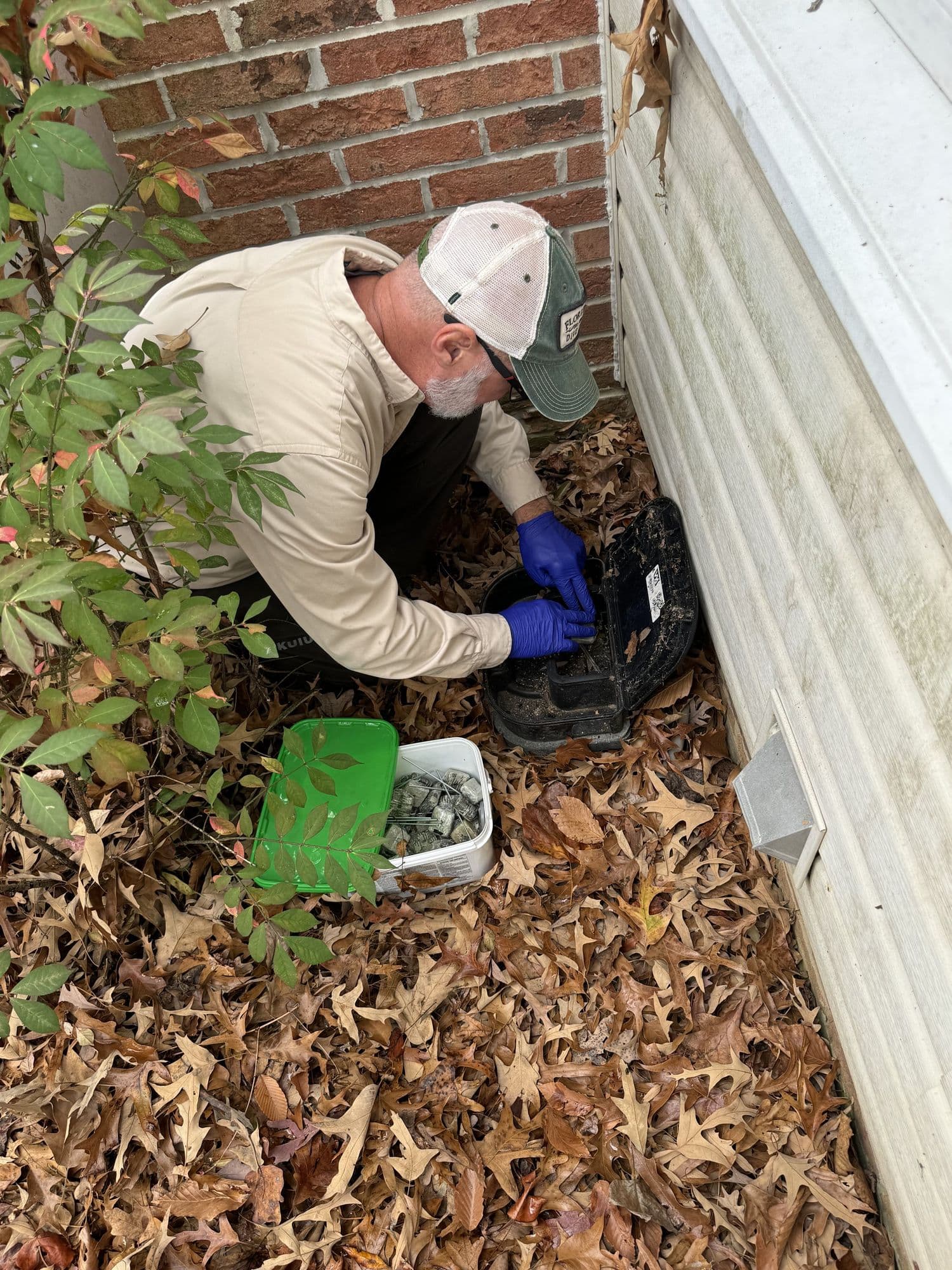 A Planet Friendly Pest Control technician performing an exterior treatment near Leonardtown MD