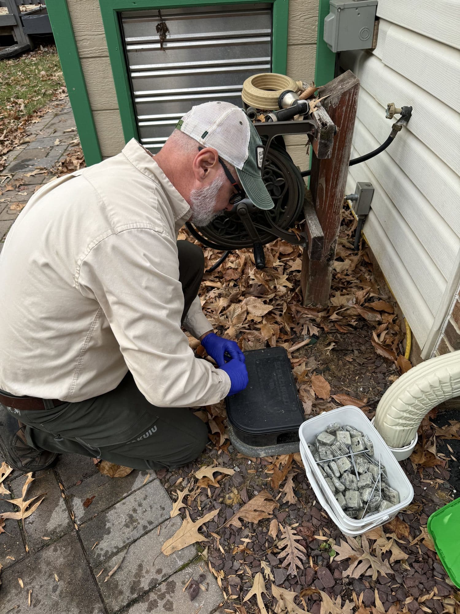A Planet Friendly Pest Control technician performing an exterior treatment near Mechanicsville MD