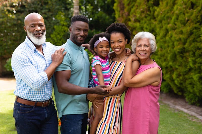 A multi-generational family enjoying their pest-free backyard